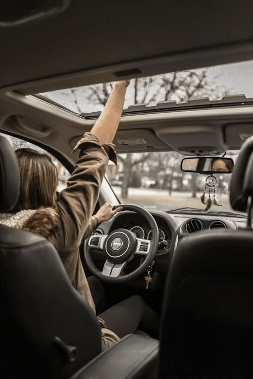 A woman taking a road trip.